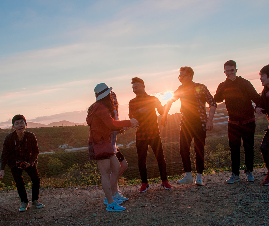 Bunch of Teens Outside by a Sunset